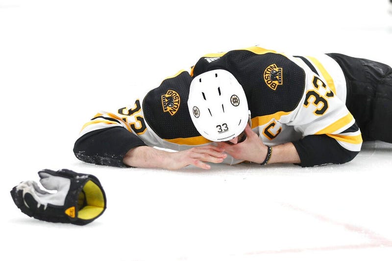 Boston Bruins defenseman Zdeno Chara, of Slovakia, lies on the ice after getting hit in the face with the puck during the second period of Game 4 of the NHL hockey Stanley Cup Final against the St. Louis Blues Monday, June 3, 2019, in St. Louis. (
