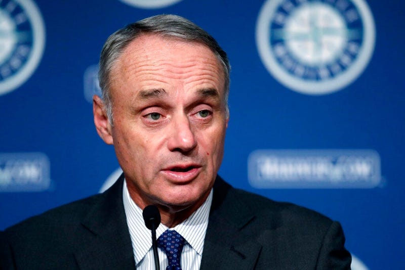 Baseball Commissioner Rob Manfred addresses reporters before a baseball game between the Seattle Mariners and the Houston Astros on Tuesday, June 4, 2019, in Seattle.