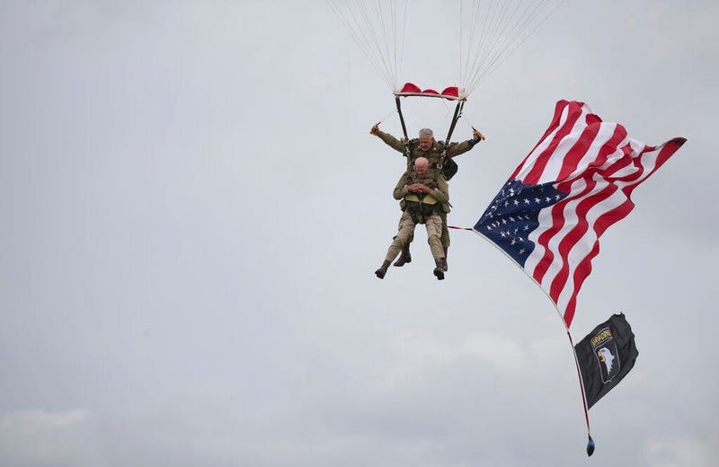 U.S. World War II D-Day veteran Tom Rice, from Coronado, CA, parachutes in a tandem jump into a field in Carentan, Normandy, France, Wednesday, June 5, 2019. Approximately 200 parachutists participated in the jump over Normandy on Wednesday, replicating a