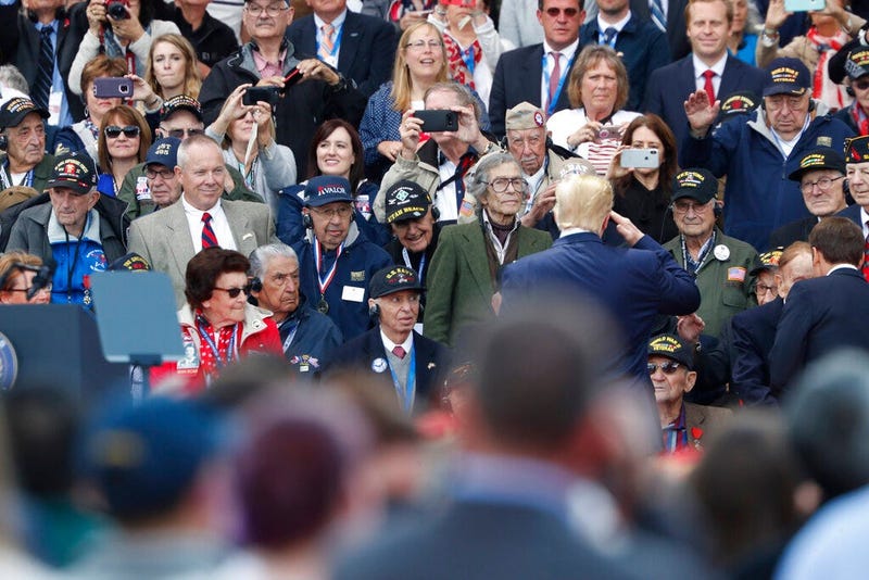 U.S. President Donald Trump salutes to veterans prior to a ceremony to mark the 75th anniversary of D-Day at the Normandy American Cemetery in Colleville-sur-Mer, Normandy, France, Thursday, June 6, 2019. World leaders are gathered Thursday in France to m