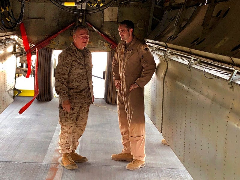 Marine Gen. Frank McKenzie, head of U.S. Central Command, confers with an Air Force officer