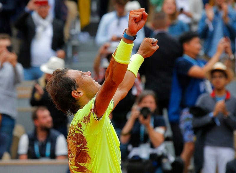 Spain's Rafael Nadal celebrates his record 12th French Open tennis tournament title after winning his men's final match against Austria's Dominic Thiem in four sets, 6-3, 5-7, 6-1, 6-1, at the Roland Garros stadium in Paris, Sunday, June 9, 2019.