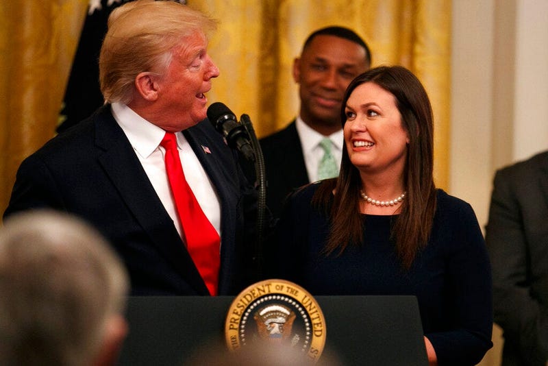 President Donald Trump welcomes White House press secretary Sarah Sanders to the stage as he pauses from speaking about second chance hiring to publicly thank the outgoing press secretary in the East Room of the White House, Thursday June 13, 2019, in Was