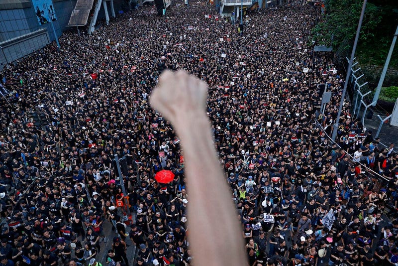 Protesters march on the streets against an extradition bill in Hong Kong on Sunday, June 16, 2019. Hong Kong residents were gathering Sunday for another massive protest over an unpopular extradition bill that has highlighted the territory's apprehension a