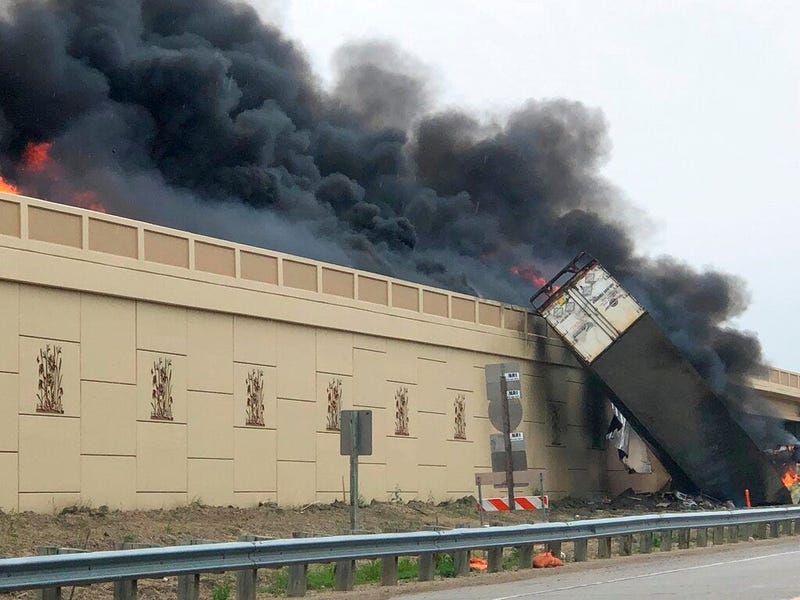 Smoke billows from a semi after a deadly crash on Interstate 94 in Caledonia, Wis, Wednesday, June 19, 2019. Authorities said the semi crashed and exploded and ignited other vehicles on the interstate in southeastern Wisconsin. 