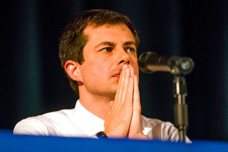 Democratic presidential candidate and South Bend Mayor Pete Buttigieg looks on during a town hall community meeting