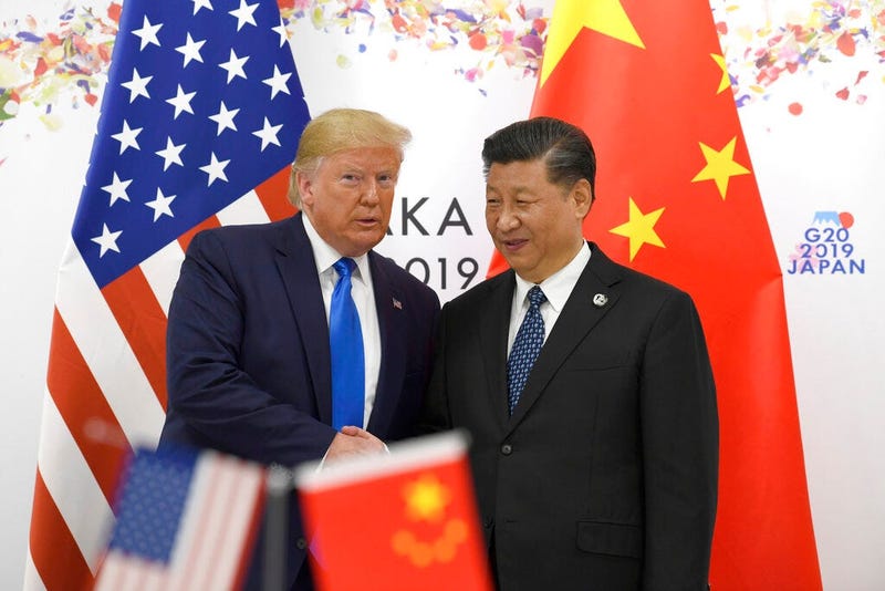 President Donald Trump poses for a photo with Chinese President Xi Jinping during a meeting on the sidelines of the G-20 summit in Osaka, Japan, Saturday, June 29, 2019.