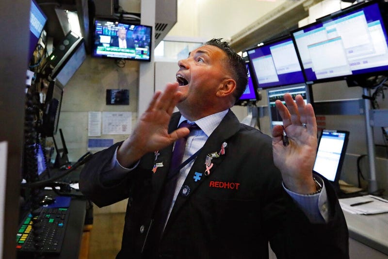 Trader Jonathan Muller works in his booth on the floor of the New York Stock Exchange, Monday, July 1, 2019. Stocks are rallying early Monday after the U.S. and China agreed to resume trade talks. 