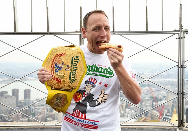 Eleven-time and defending men's champion Joey Chestnut poses on the 86th floor observation deck during the Nathan's Famous international Fourth of July hot dog eating contest weigh-in at the Empire State Building on July 3, 2019.