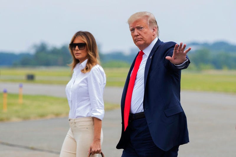 President Donald Trump and first lady Melania Trump, walk on the tarmac upon arrival at Morristown Municipal Airport, in Morristown, N.J., Friday, July 5, 2019.