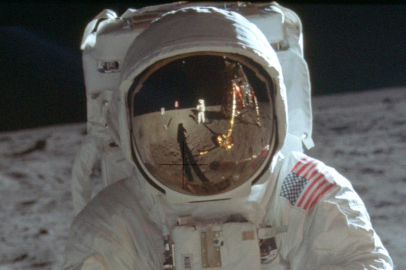Neil Armstrong reflected in the helmet visor of Buzz Aldrin on the surface of the moon.