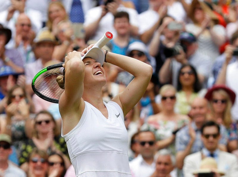 Romania's Simona Halep celebrates after defeating United States' Serena Williams during the women's singles final match on day twelve of the Wimbledon Tennis Championships in London, Saturday, July 13, 2019.