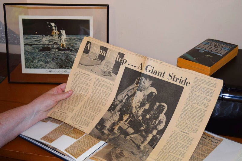 Cathy Goff shows her with newspaper clippings about the Apollo 11 moon landing mission at her home in King, N.C