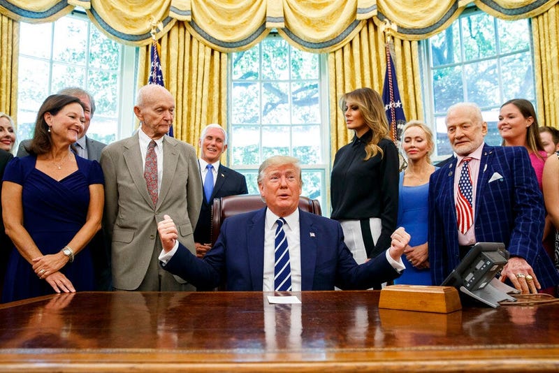 President Donald Trump, accompanied by Apollo 11 astronauts Michael Collins, second from left, and Buzz Aldrin, second from right, with Vice President Mike Pence and first lady Melania Trump, speaks during a photo opportunity commemorating the 50th annive