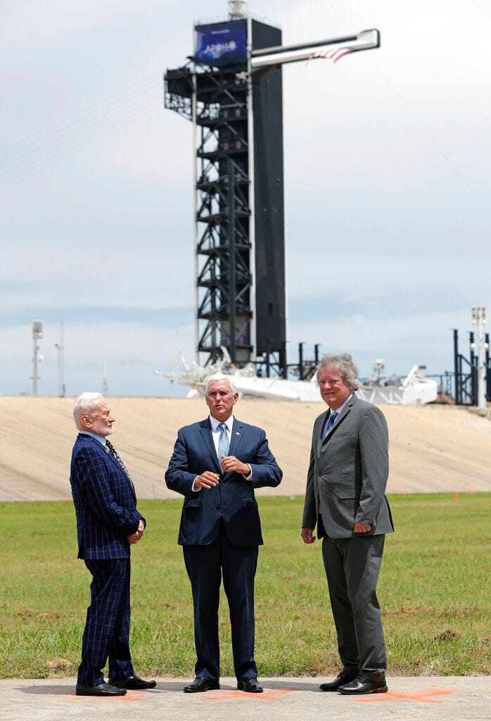 Apollo astronaut Buzz Aldrin, left, talks with Vice President Mike Pence, center, and Rick Armstrong, son of Apollo 11 astronaut Neil Armstrong