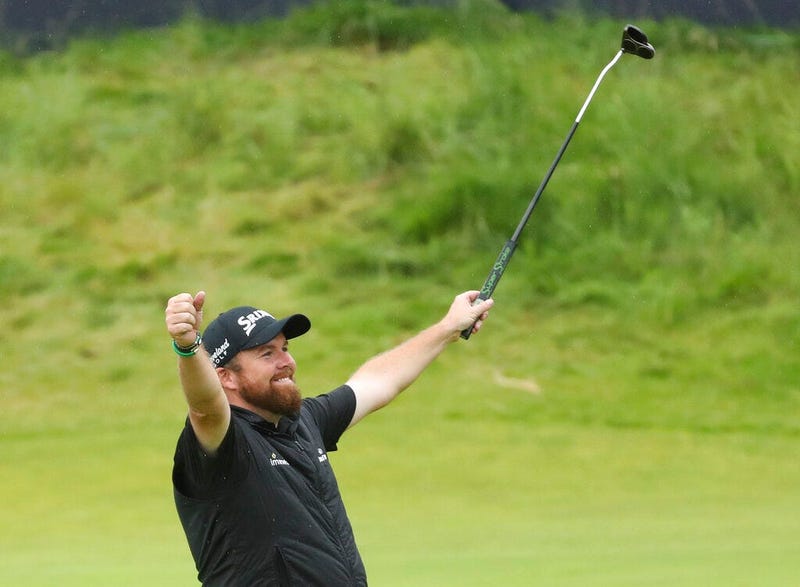 Ireland's Shane Lowry lifts his club to celebrate as he wins the British Open Golf Championships at Royal Portrush in Northern Ireland, Sunday, July 21, 2019.