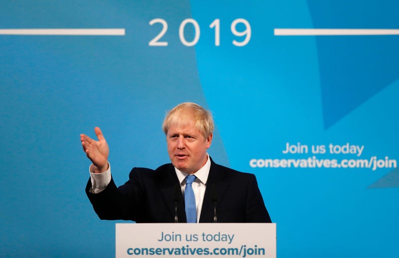Boris Johnson gestures as he speaks after being announced as the new leader of the Conservative Party in London, Tuesday, July 23, 2019.