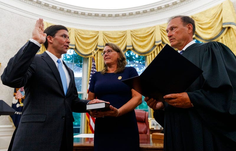 Mark Esper, left, is sworn in as the Secretary of Defense by Supreme Court Justice Samuel Alito, right