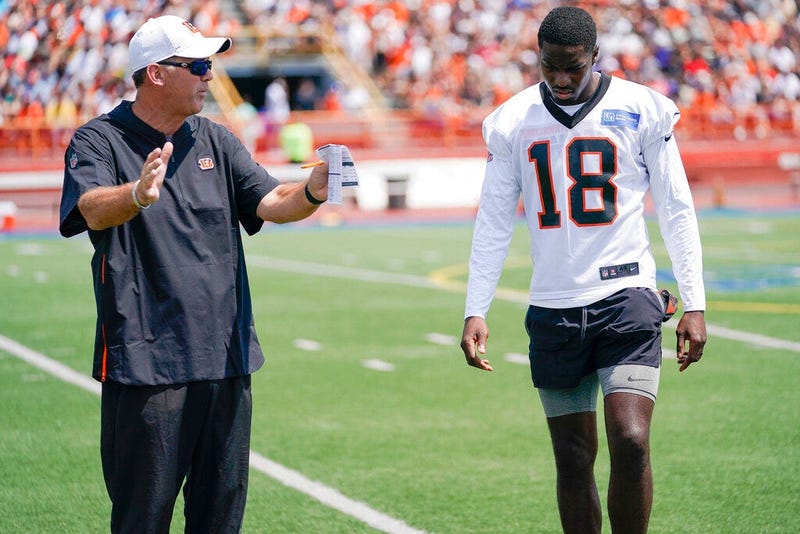 Cincinnati Bengal wide receiver A.J. Green (18) receives instruction from receivers coach Bob Bicknell during the first day of NFL football training camp Saturday, July 27, 2019, in Dayton, Ohio.