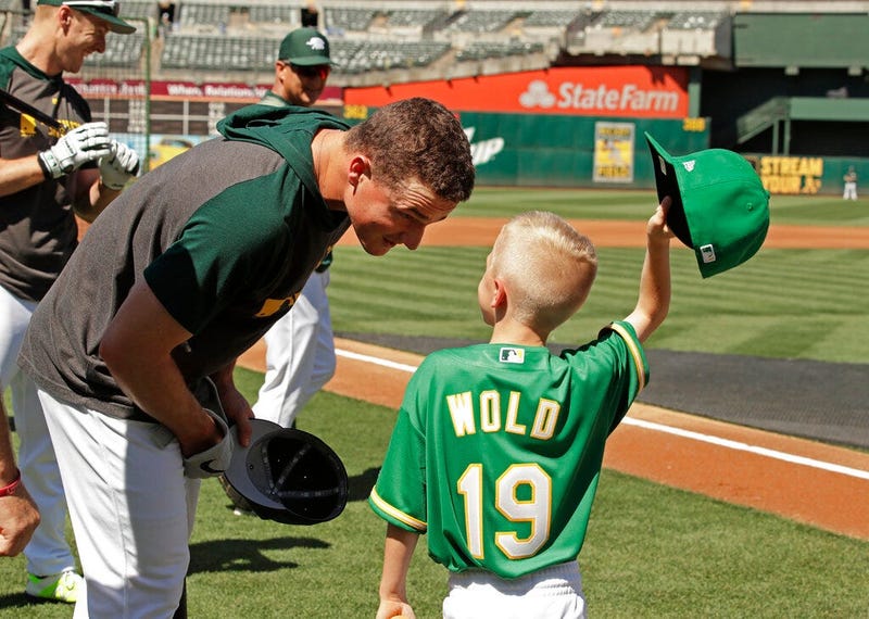 Eight-year-old August Wold (19) compares his haircut to Oakland Athletics' Matt Chapman's