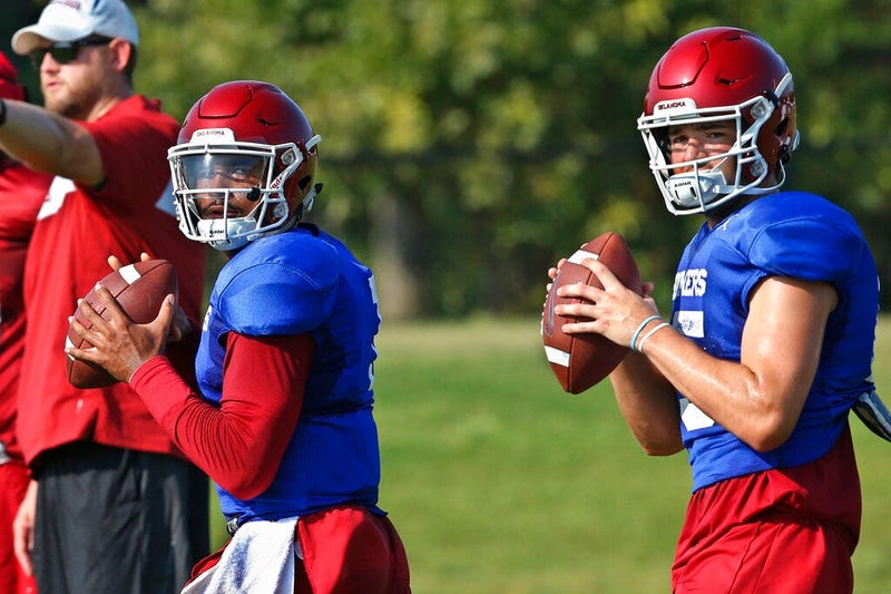 Oklahoma quarterbacks Jalen Hurts, left, and Tanner Mordecai