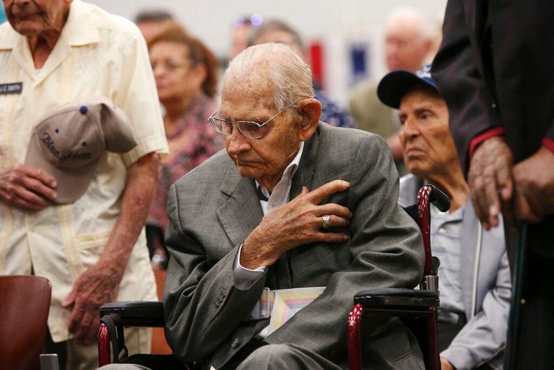 Cyrus Hayford Avey, Jr, 100, U.S. Air Force World War II veteran honors the flag during a ceremony at Joint Base San Antonio-Fort Sam Houston