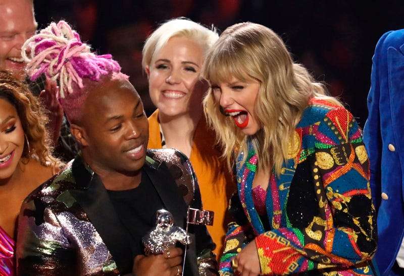 Taylor Swift, right, accepts the video for good award for "YouNeed to Calm Down" at the MTV Video Music Awards at the Prudential Center on Monday, Aug. 26, 2019, in Newark, N.J.