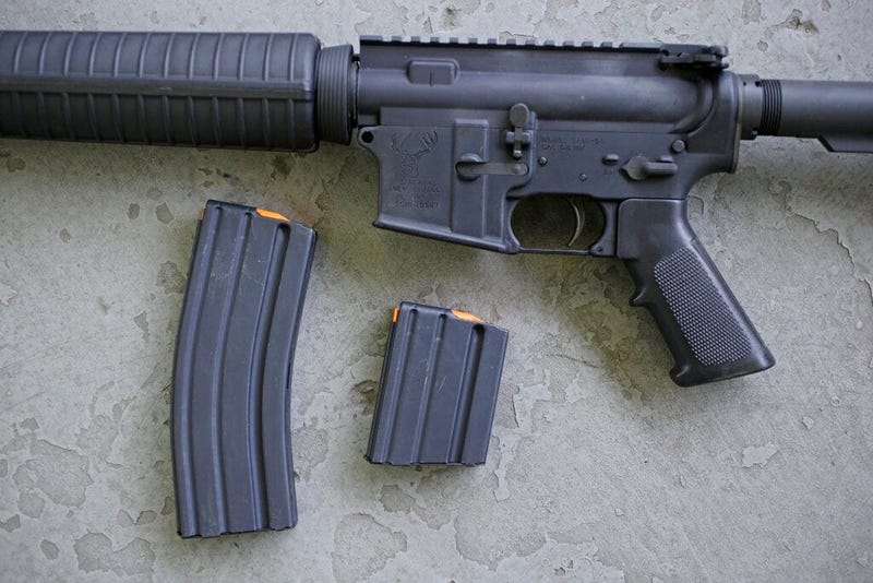 a stag arms AR-15 rifle with 30 round, left, and 10 round magazines