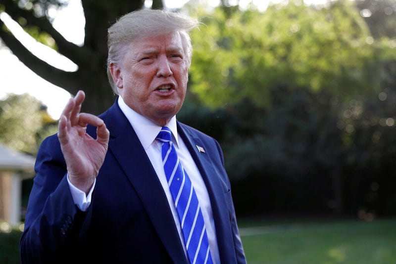 President Donald Trump talks with reporters on the South Lawn of the White House in Washington, Friday, Aug. 30, 2019, en route to Camp David in Maryland. (