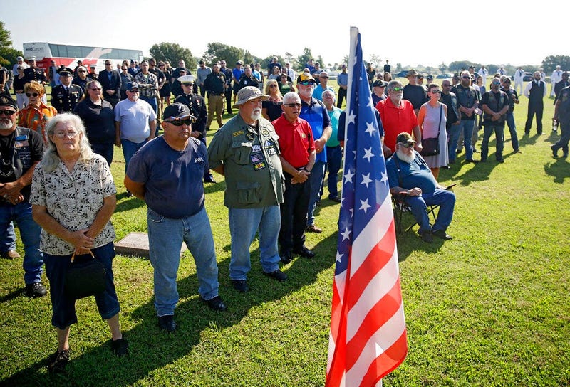 Mourners attend a funeral service for World War II veteran Herman White