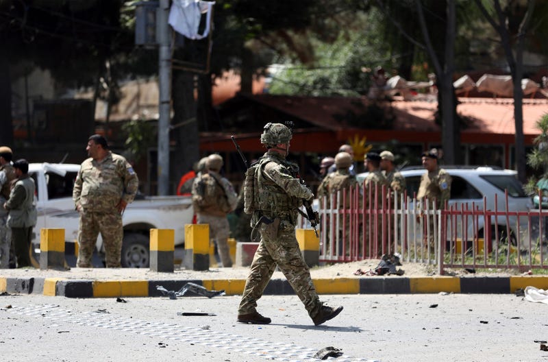 Resolute Support (RS) forces and Afghan security personnel inspect the site of a car bomb explosion in Kabul, Afghanistan, Thursday, Sept. 5, 2019.