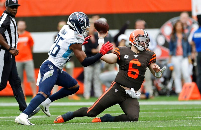 Cleveland Browns quarterback Baker Mayfield (6) throws under pressure from Tennessee Titans cornerback Logan Ryan (26) during the first half in an NFL football game, Sunday, Sept. 8, 2019, in Cleveland.