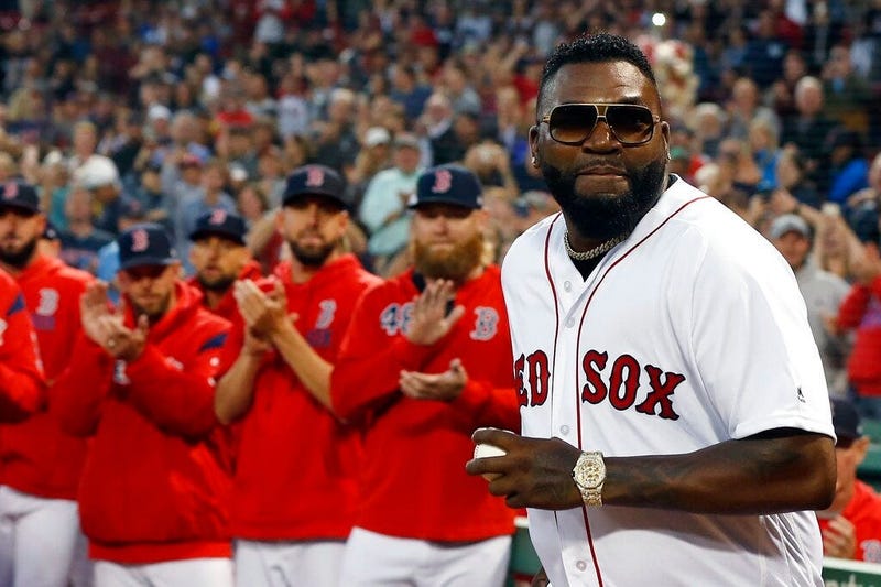Former Boston Red Sox's David Ortiz comes onto the field to throw out a ceremonial first pitch before a baseball game against the New York Yankees in Boston, Monday, Sept. 9, 2019.