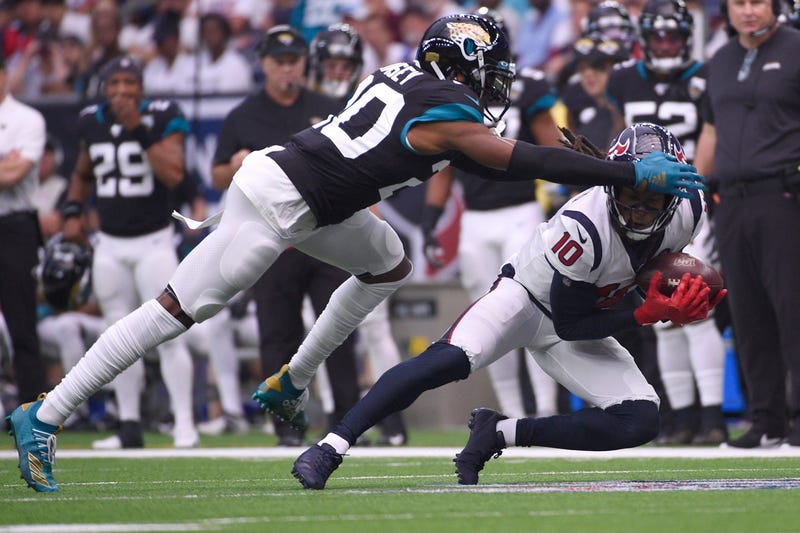 Houston Texans wide receiver DeAndre Hopkins (10) makes a catch in front of Jacksonville Jaguars cornerback Jalen Ramsey (20) during the first half of an NFL football game Sunday, Sept. 15, 2019, in Houston. 