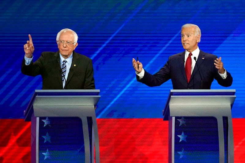 Sen. Bernie Sanders, I-Vt., left, and former Vice President Joe Biden speak during a Democratic presidential primary debate hosted by ABC at Texas Southern University in Houston.