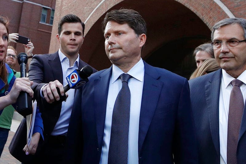 Devin Sloane, middle, leaves federal court after his sentencing in a nationwide college admissions bribery scandal, Tuesday, Sept. 24, 2019, in Boston.