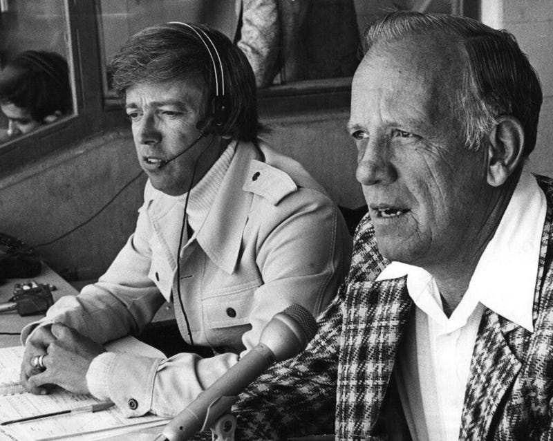 Marty Brennaman, left, and Joe Nuxhall in the Reds radio booth at Riverfront Stadium in Cincinnati.