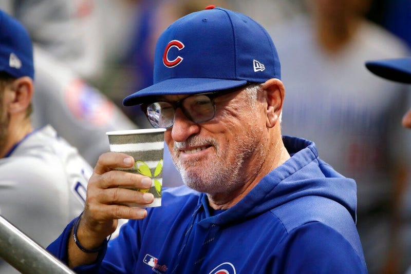 Chicago Cubs manager Joe Maddon salutes a fan from the dugout before a baseball game against the Pittsburgh Pirates in Pittsburgh, Wednesday, Sept. 25, 2019. (