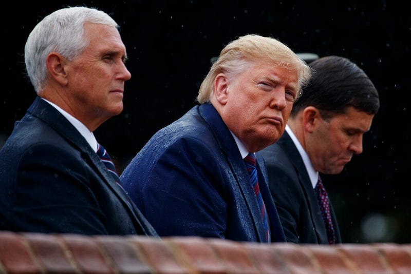 From left, Vice President Mike Pence, President Donald Trump, and Defense Secretary Mark Esper, participate in an Armed Forces welcome ceremony for the new chairman of the Joint Chiefs of Staff, Gen. Mark Milley, Monday, Sept. 30, 2019, at Joint Base Myer