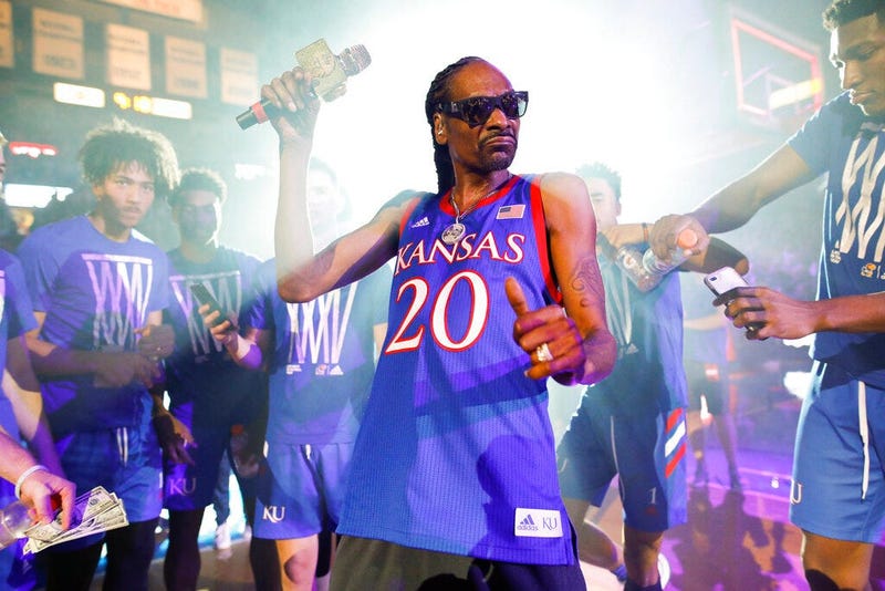 rapper Snoop Dogg performs for the Allen Fieldhouse crowd during Late Night in the Phog, Kansas' annual NCAA college basketball kickoff at Allen Fieldhouse in Lawrence, Kan.