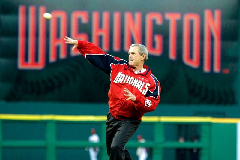 President George W. Bush throws out the ceremonial first pitch at the Washington Nationals home opener in Washington. The Nationals play the Arizona Diamondbacks in the first regular season baseball game in Washington in 34 years.