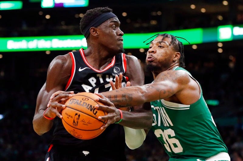 Boston Celtics' Marcus Smart (36) defends against Toronto Raptors' Pascal Siakam during the second half of an NBA basketball game in Boston, Friday, Oct. 25, 2019.