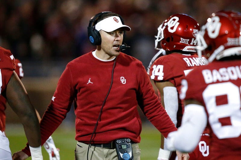 Oklahoma head coach Lincoln Riley greets players as they return to the sideline after scoring in the first half of an NCAA college football game against TCU in Norman, Okla., Saturday, Nov. 23, 2019.