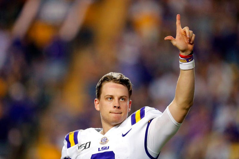 LSU quarterback Joe Burrow, who is considered a frontrunner for the Heisman Trophy, acknowledges the crowd as he is pulled from his last game in Tiger Stadium, in the fourth quarter of the team's NCAA college football matchup against Texas A&M in Baton Ro