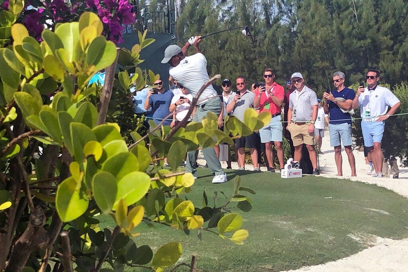 Tiger Woods hits on the par-5 11th hole on his way to an eagle at Albany Golf Club during the second round of the Hero World Challenge in Nassau, Bahamas, Thursday Dec. 5 2019. Woods shot 66.