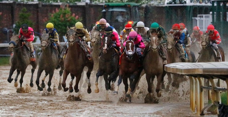 Luis Saez rides Maximum Security, second from right, to the finish line during the 145th running of the Kentucky Derby horse race at Churchill Downs, May 4, 2019, in Louisville, Ky.