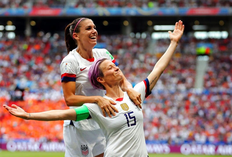 United States' Megan Rapinoe, right, celebrates after scoring the opening goal from the penalty spot during the Women's World Cup final soccer match between U.S. and The Netherlands at the Stade de Lyon in Decines, outside Lyon, France, July 7, 2019. 