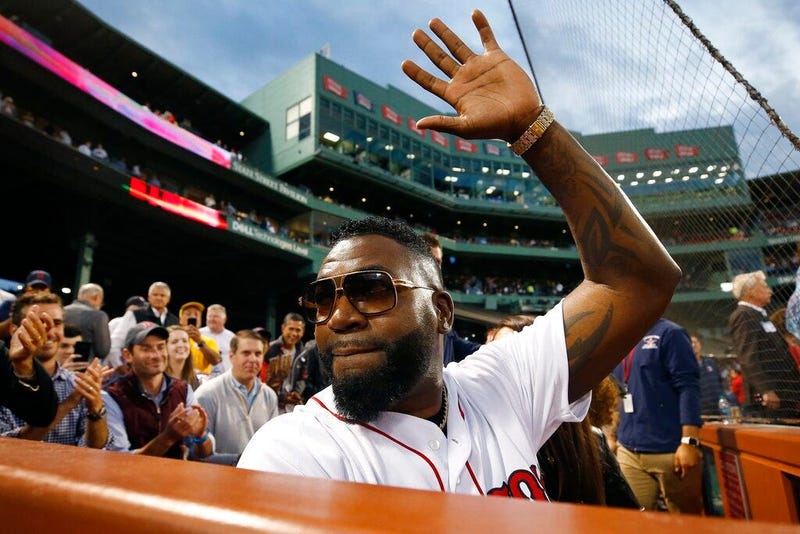 Former Boston Red Sox's David Ortiz waves to the crowd after throwing out a ceremonial first pitch before a baseball game against the New York Yankees in Boston, Sept. 9, 2019. 