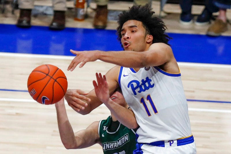 Pittsburgh's Justin Champagnie (11) tries to catch a pass as Binghamton's Dan Petcash defends during the second half of an NCAA college basketball game Friday, Dec. 20, 2019, in Pittsburgh. Pittsburgh won 79-53.