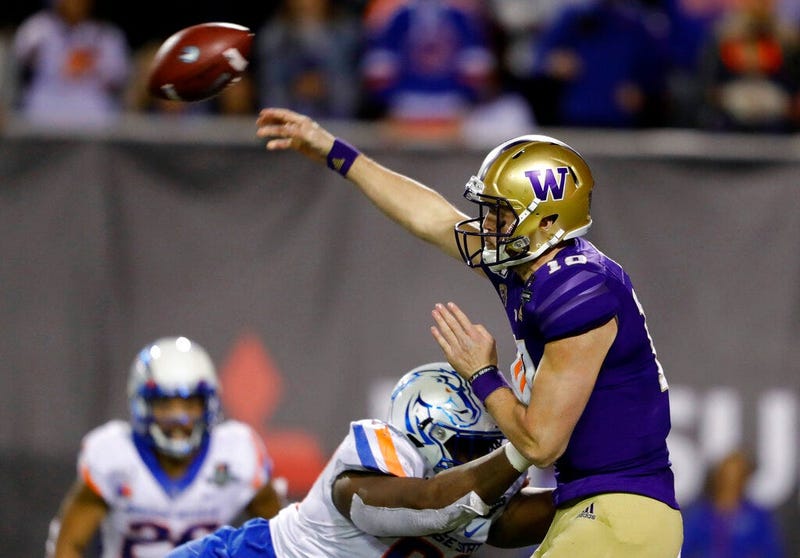 Washington quarterback Jacob Eason (10) passes under pressure from Boise State nose tackle Scale Igiehon (90) during the second half of the Las Vegas Bowl NCAA college football game at Sam Boyd Stadium, Saturday, Dec. 21, 2019, in Las Vegas.